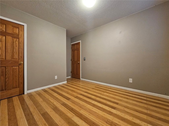 1523 Golden Valley Dr, Bettendorf, IA 52722 - empty room with a textured ceiling and light wood-type flooring