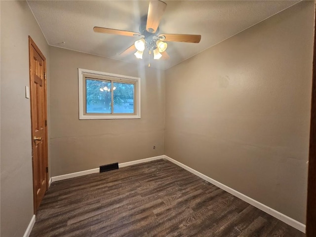1523 Golden Valley Dr, Bettendorf, IA 52722 - spare room featuring dark wood-style flooring and a ceiling fan