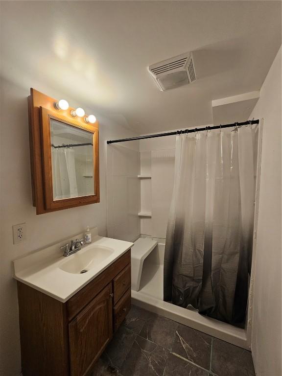 1523 Golden Valley Dr, Bettendorf, IA 52722 - bathroom with vanity, a shower with curtain, and marble look tile flooring