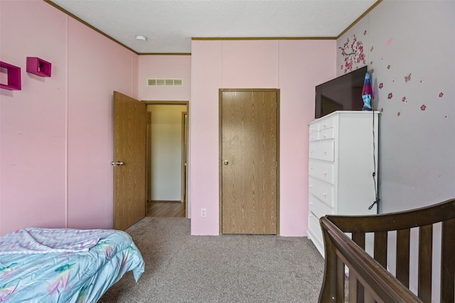 3017 118th St, Amana, IA 52203 - bedroom with carpet, crown molding, and a textured ceiling