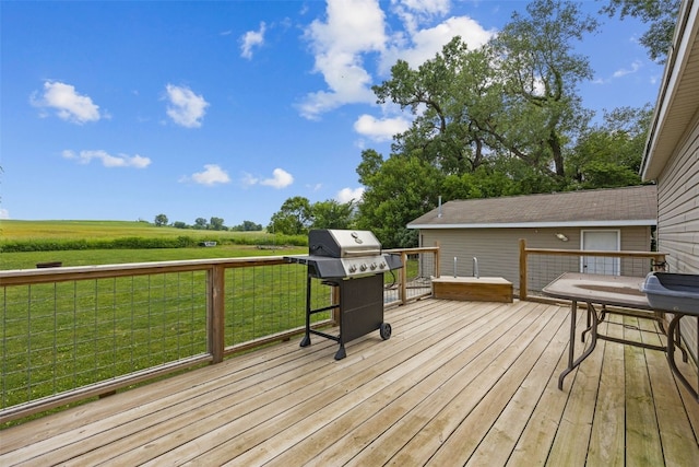 3017 118th St, Amana, IA 52203 - wooden deck featuring grilling area, a yard, and a view of countryside