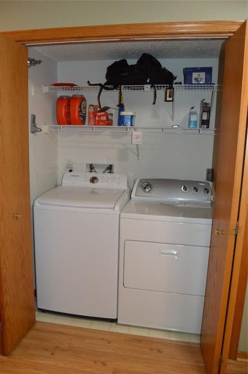 454 W Side Dr, Iowa City, IA 52245 - washroom featuring independent washer and dryer and light wood-style floors