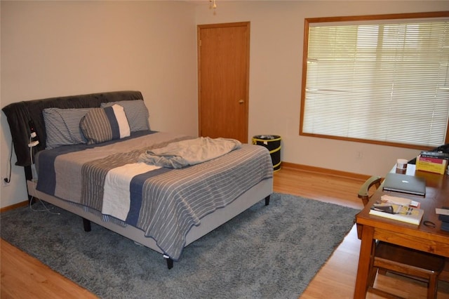 454 W Side Dr, Iowa City, IA 52245 - bedroom with wood finished floors and baseboards