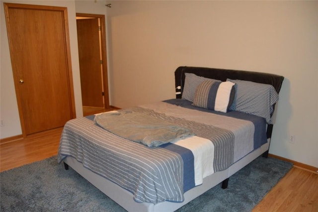 454 W Side Dr, Iowa City, IA 52245 - bedroom featuring wood finished floors and baseboards