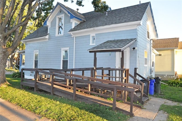 1402 N St SW, Cedar Rapids, IA 52404 - back of house with a deck and roof with shingles