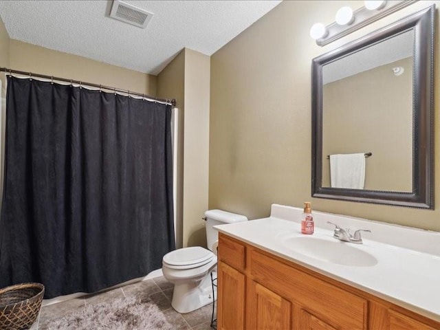 1020 240th St NE Unit 8, North Liberty, IA 52317 - bathroom featuring vanity, tile patterned floors, a textured ceiling, and a shower with shower curtain