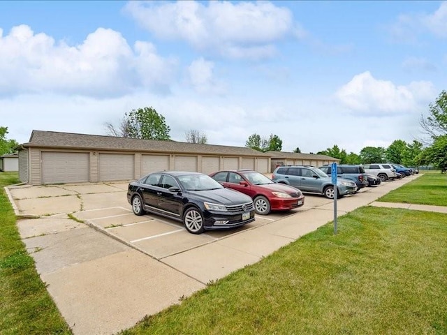 1020 240th St NE Unit 8, North Liberty, IA 52317 - uncovered parking lot with community garages