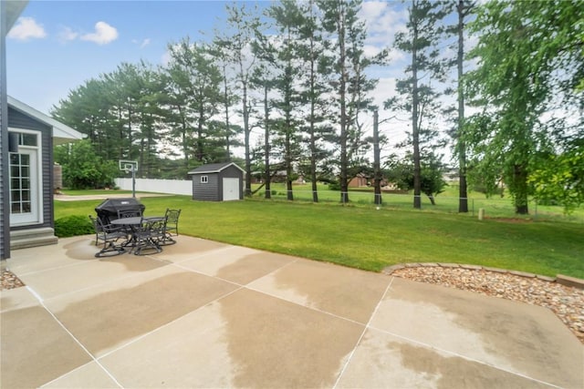 2385 Wolf Creek Trl, Hiawatha, IA 52233 - view of patio with a storage unit, a grill, and outdoor dining space