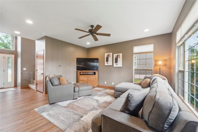 2385 Wolf Creek Trl, Hiawatha, IA 52233 - living area with light wood finished floors, ceiling fan, and recessed lighting