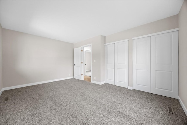 6612 Boulder Dr, Cedar Rapids, IA 52405 - unfurnished bedroom with carpet floors and multiple closets