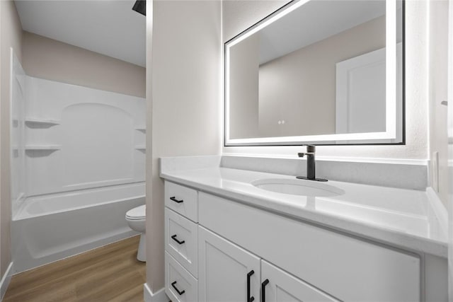 6612 Boulder Dr, Cedar Rapids, IA 52405 - bathroom featuring wood finished floors, vanity, and bathtub / shower combination