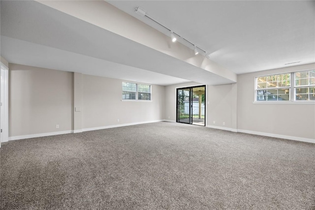 6612 Boulder Dr, Cedar Rapids, IA 52405 - carpeted spare room featuring rail lighting and baseboards