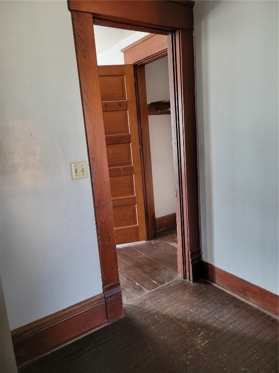 606 Meridian St, Tipton, IA 52772 - corridor with hardwood / wood-style flooring and baseboards