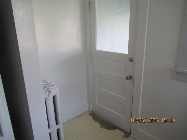 606 Meridian St, Tipton, IA 52772 - entryway with radiator and light flooring