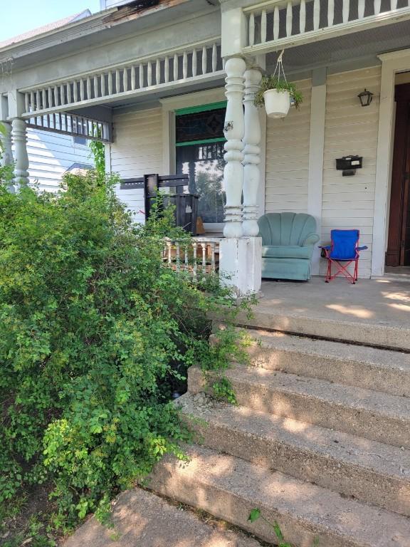 606 Meridian St, Tipton, IA 52772 - doorway to property with a porch