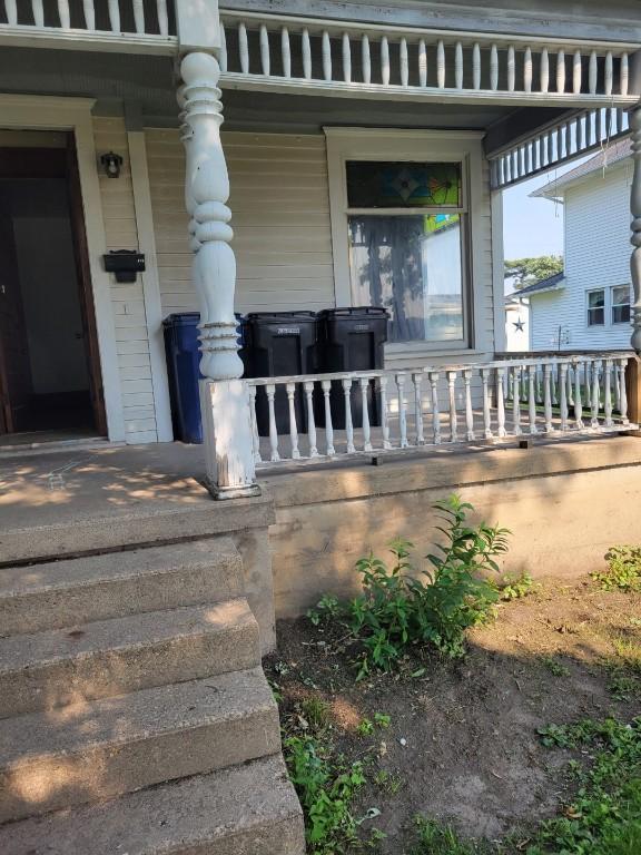 606 Meridian St, Tipton, IA 52772 - entrance to property featuring covered porch