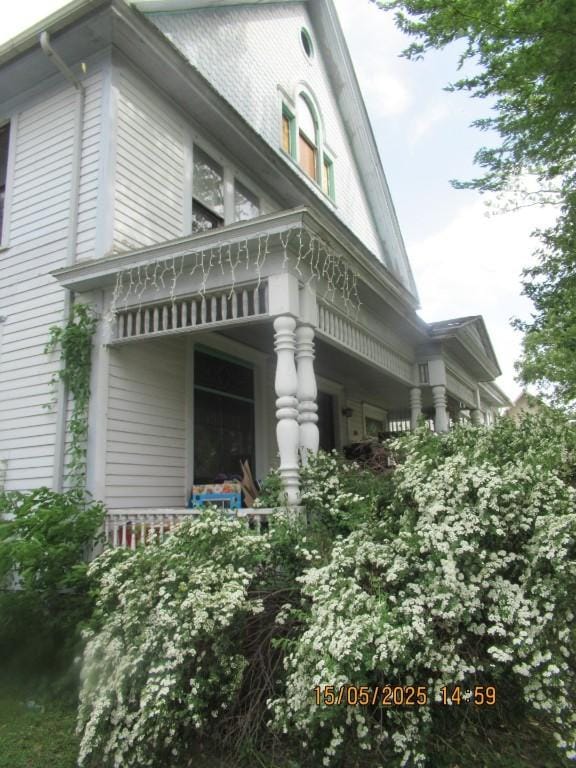 606 Meridian St, Tipton, IA 52772 - view of property exterior featuring a porch