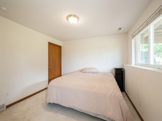 2635 6th St, Marion, IA 52302 - bedroom featuring light colored carpet and baseboards