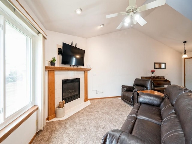 2635 6th St, Marion, IA 52302 - living area featuring carpet flooring, plenty of natural light, vaulted ceiling, a tiled fireplace, and ceiling fan