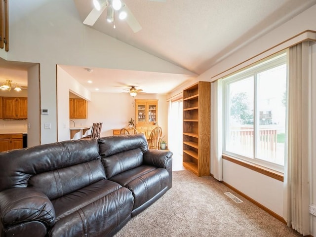 2635 6th St, Marion, IA 52302 - living area with ceiling fan, lofted ceiling, and light colored carpet