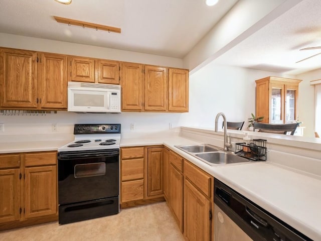 2635 6th St, Marion, IA 52302 - kitchen with white microwave, electric range oven, stainless steel dishwasher, and light countertops