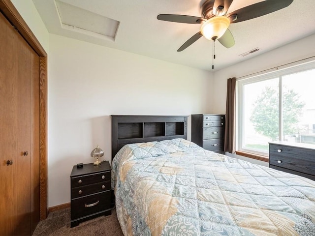 2635 6th St, Marion, IA 52302 - bedroom featuring carpet, a closet, attic access, and ceiling fan