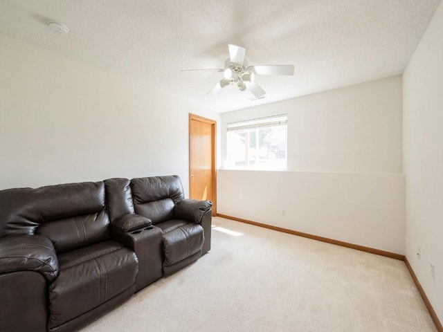 2635 6th St, Marion, IA 52302 - living area featuring light carpet, a ceiling fan, and a textured ceiling