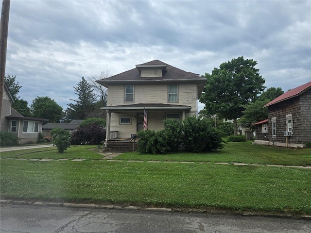 708 E 4th St, Vinton, IA 52349 - american foursquare style home featuring covered porch and a front lawn