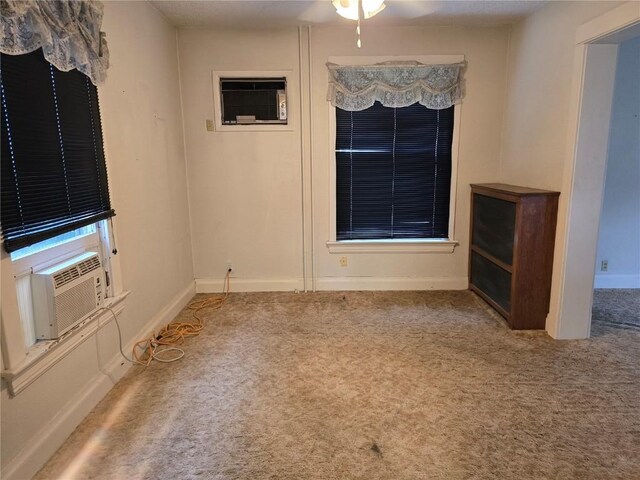 708 E 4th St, Vinton, IA 52349 - unfurnished dining area with carpet flooring, cooling unit, and a ceiling fan