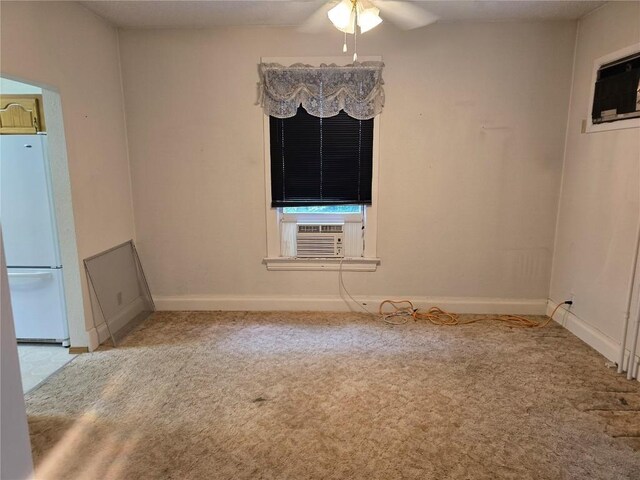 708 E 4th St, Vinton, IA 52349 - unfurnished dining area with carpet floors, cooling unit, and ceiling fan