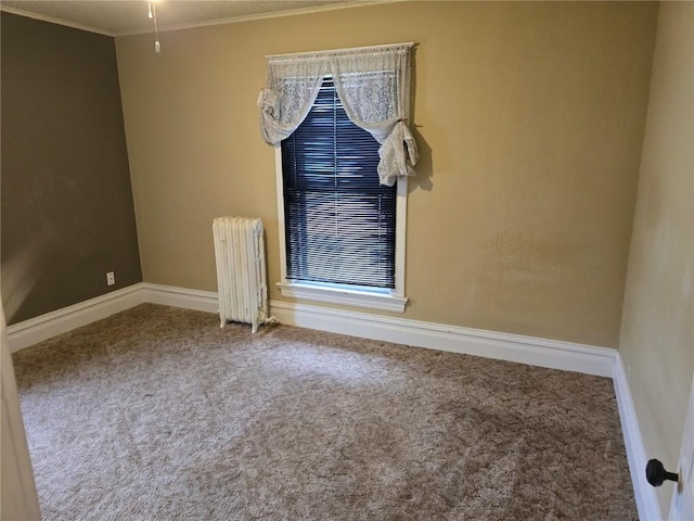 708 E 4th St, Vinton, IA 52349 - unfurnished room featuring radiator, carpet flooring, and ornamental molding