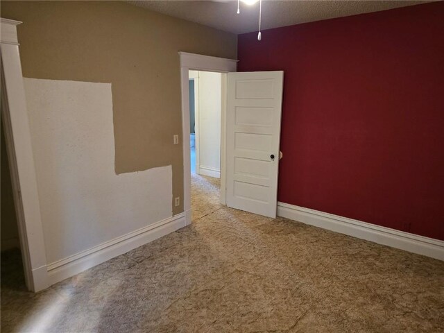708 E 4th St, Vinton, IA 52349 - unfurnished room with carpet flooring and ceiling fan