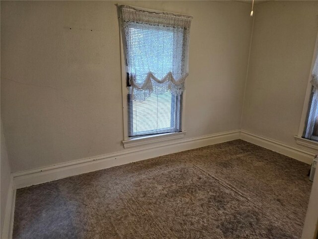708 E 4th St, Vinton, IA 52349 - carpeted spare room with baseboards