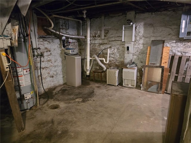 708 E 4th St, Vinton, IA 52349 - unfinished basement with a water softener, water heater, and electric panel