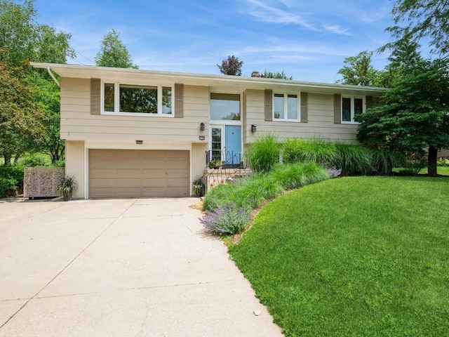 4288 Fox Meadow Dr SE, Cedar Rapids, IA 52403 - bi-level home featuring a garage, concrete driveway, and a front yard