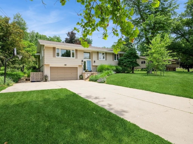 4288 Fox Meadow Dr SE, Cedar Rapids, IA 52403 - split foyer home with concrete driveway, a garage, and a front lawn