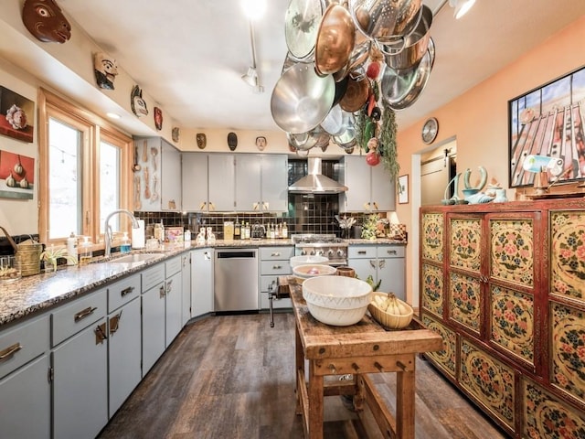 4288 Fox Meadow Dr SE, Cedar Rapids, IA 52403 - kitchen featuring dishwasher, wall chimney exhaust hood, dark wood-type flooring, tasteful backsplash, and stovetop