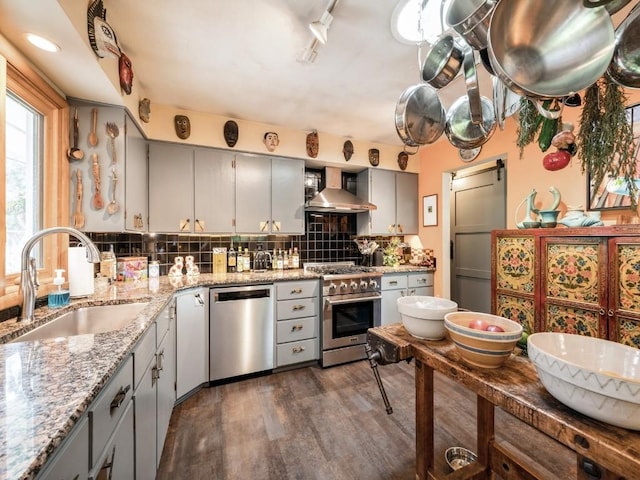 4288 Fox Meadow Dr SE, Cedar Rapids, IA 52403 - kitchen with appliances with stainless steel finishes, wall chimney range hood, gray cabinets, and dark wood-style flooring