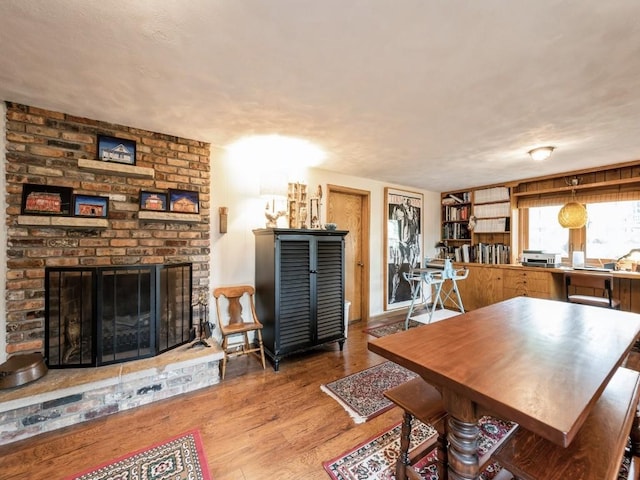 4288 Fox Meadow Dr SE, Cedar Rapids, IA 52403 - dining area with wood finished floors and a brick fireplace
