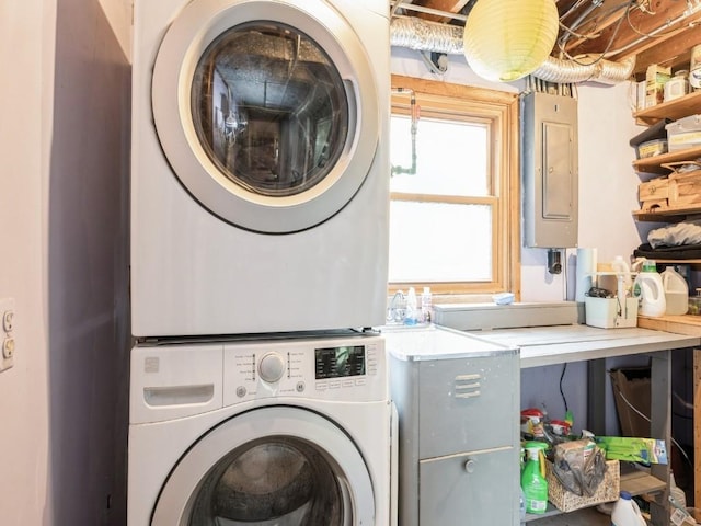 4288 Fox Meadow Dr SE, Cedar Rapids, IA 52403 - washroom featuring electric panel and stacked washing machine and dryer