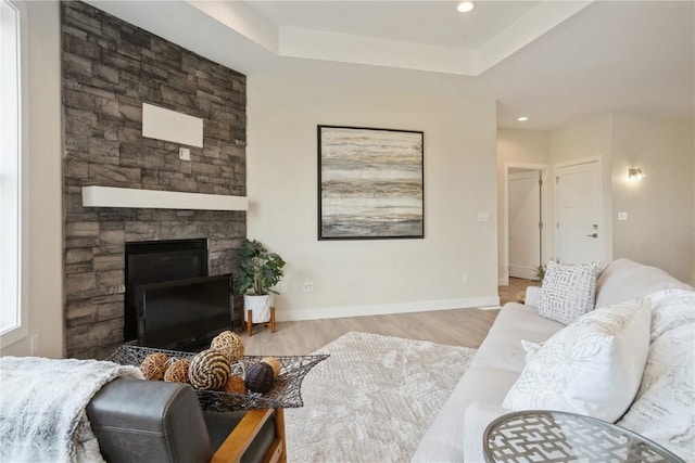 1417 Echo Ridge Ln, Marion, IA 52302 - living room featuring wood finished floors, a fireplace, a raised ceiling, and recessed lighting