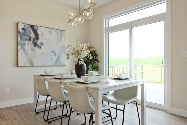 1417 Echo Ridge Ln, Marion, IA 52302 - dining room featuring a chandelier and light wood finished floors