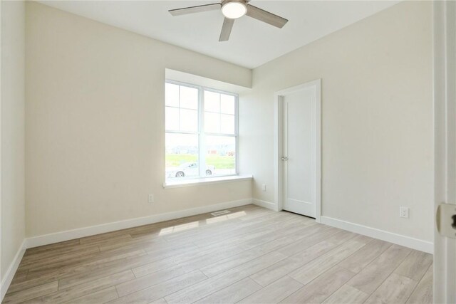 1417 Echo Ridge Ln, Marion, IA 52302 - empty room featuring ceiling fan and light wood finished floors