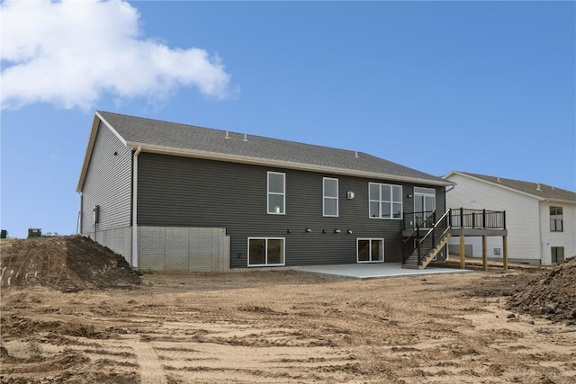 1417 Echo Ridge Ln, Marion, IA 52302 - back of property featuring a patio, a wooden deck, and stairway