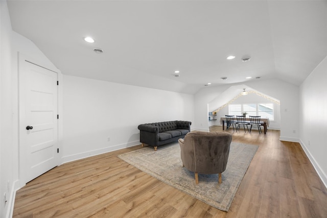 1153 Cedar Springs Dr, Marion, IA 52302 - living area with lofted ceiling, light wood-style flooring, and recessed lighting