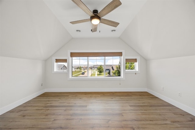 1153 Cedar Springs Dr, Marion, IA 52302 - additional living space with vaulted ceiling, a ceiling fan, and wood finished floors
