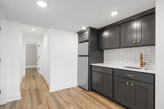 1153 Cedar Springs Dr, Marion, IA 52302 - bar with freestanding refrigerator, backsplash, light wood-style floors, and recessed lighting