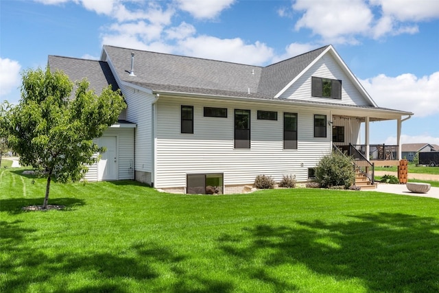 1153 Cedar Springs Dr, Marion, IA 52302 - back of property with a yard, roof with shingles, stairs, and a porch
