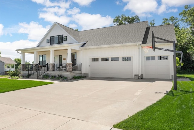 1153 Cedar Springs Dr, Marion, IA 52302 - modern farmhouse featuring an attached garage, a porch, driveway, a shingled roof, and a front lawn