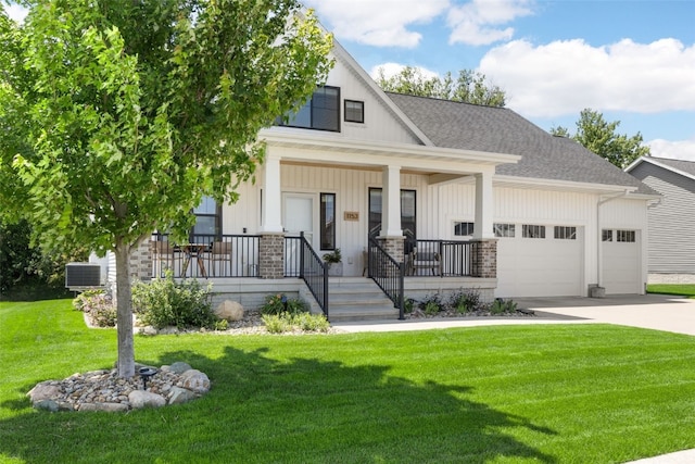 1153 Cedar Springs Dr, Marion, IA 52302 - modern farmhouse featuring a garage, concrete driveway, covered porch, board and batten siding, and a front yard